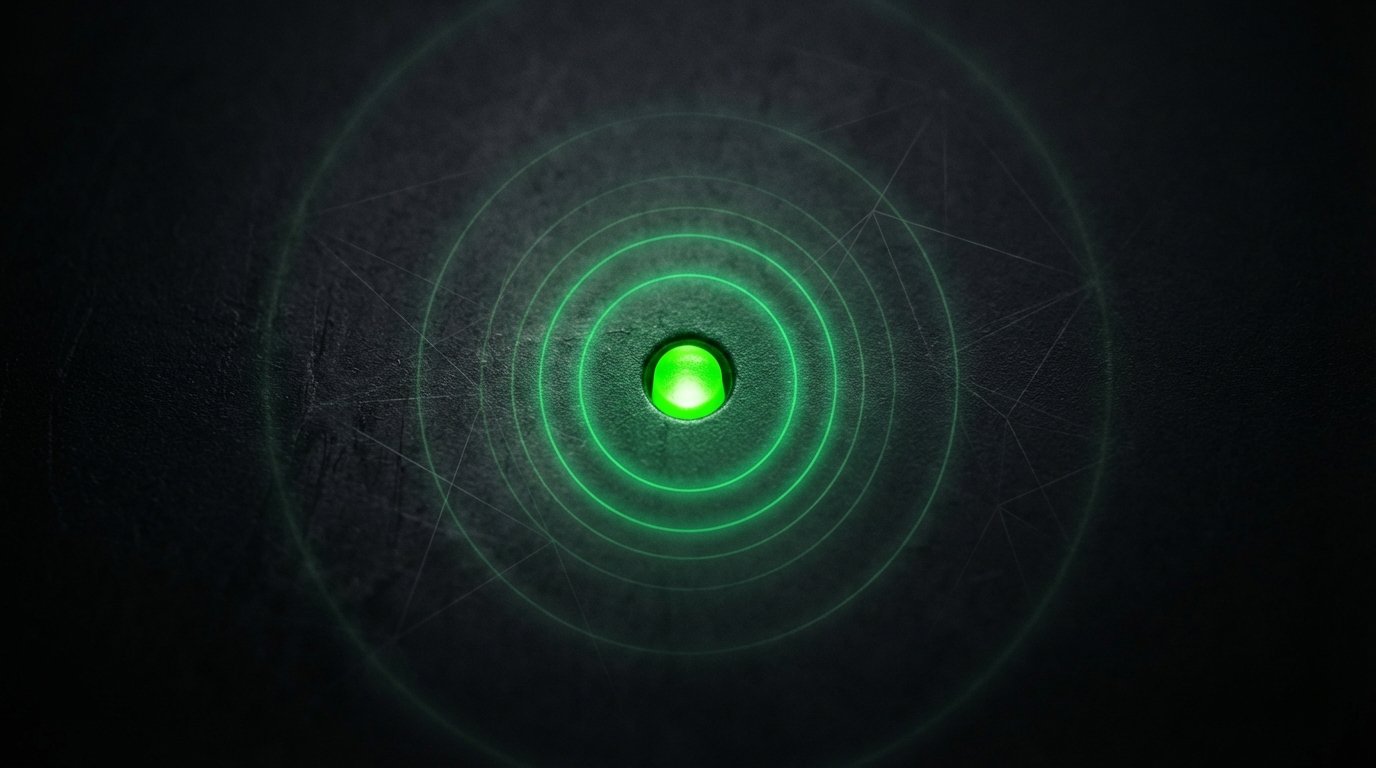 Green status beacon glowing in darkness